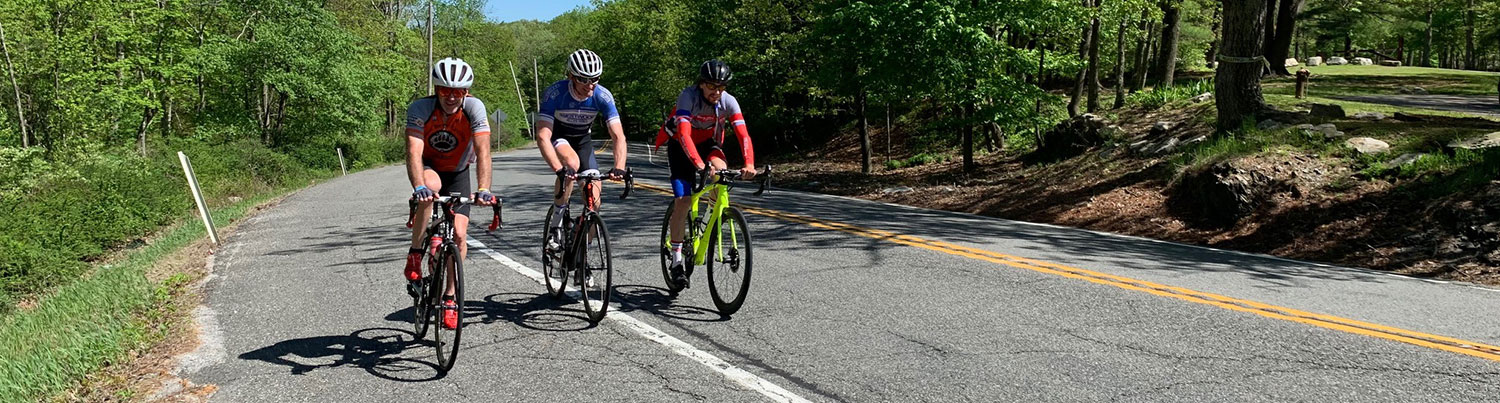 a trio of riders climbing route 23